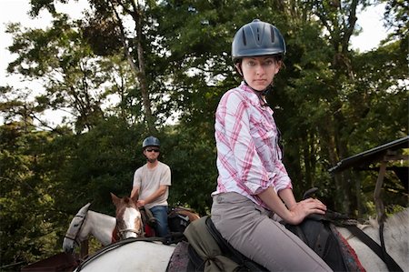 Equestrian couple posing on a horse ranch in Costa Rica Stock Photo - Budget Royalty-Free & Subscription, Code: 400-04219799