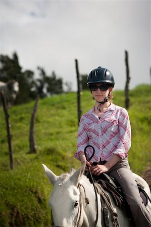simsearch:400-05342352,k - Equestrian woman on horses ranch in Costa Rica Stock Photo - Budget Royalty-Free & Subscription, Code: 400-04219800