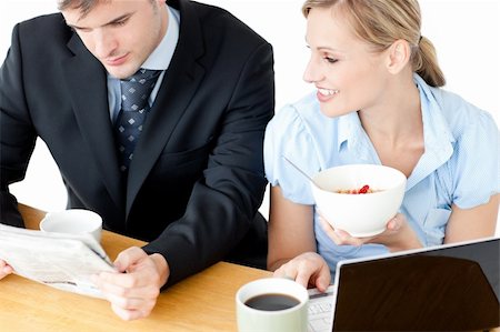 simsearch:400-05737647,k - Happy couple of businesspeople having breakfast reading the newspaper at home Stock Photo - Budget Royalty-Free & Subscription, Code: 400-04210046