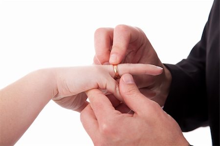 simsearch:400-04694901,k - hand of a man putting a ring on the hand of a woman, isolated on white background. Studio shot Stock Photo - Budget Royalty-Free & Subscription, Code: 400-04210212