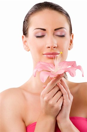 simsearch:400-04323317,k - beauty shot of graceful brunette with pink lily in act to smell the flower Stock Photo - Budget Royalty-Free & Subscription, Code: 400-04210464