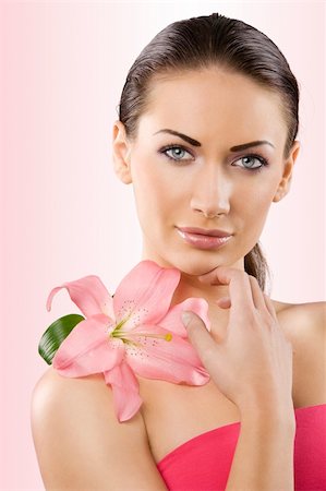 simsearch:400-04323317,k - close up portrait of graceful brunette with pink lily and stunning blue eyes Stock Photo - Budget Royalty-Free & Subscription, Code: 400-04210462