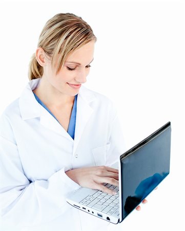 doctor business computer - Self-assured female doctor holding a laptop against white background Stock Photo - Budget Royalty-Free & Subscription, Code: 400-04210577