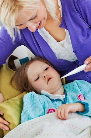 simsearch:400-04212905,k - Attentive mother takes her daughter's temperature at home Stock Photo - Budget Royalty-Free & Subscription, Code: 400-04210821