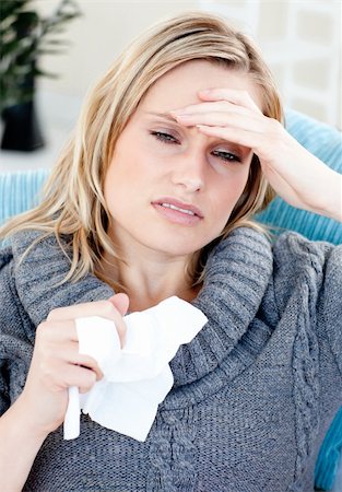 simsearch:400-04212905,k - Caucasian woman with headache and tissues at home in the living-room Stock Photo - Budget Royalty-Free & Subscription, Code: 400-04210852