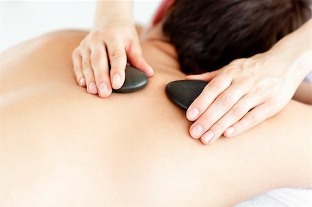 simsearch:400-04192103,k - Close-up of a man with hot stone on his back in a spa center Stock Photo - Budget Royalty-Free & Subscription, Code: 400-04210868