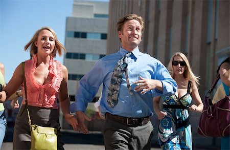 Man races ahead of women in the city. Stock Photo - Budget Royalty-Free & Subscription, Code: 400-04211101