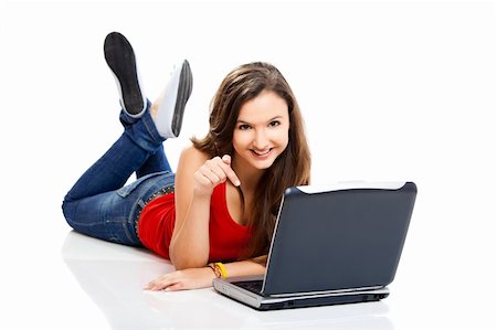 Beautiful and happy girl with a laptop, isolated on white Stock Photo - Budget Royalty-Free & Subscription, Code: 400-04211448
