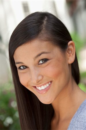 simsearch:6108-05867864,k - Portrait of a beautiful Asian woman smiling into the camera in an outdoor setting. Vertical shot. Stockbilder - Microstock & Abonnement, Bildnummer: 400-04211621