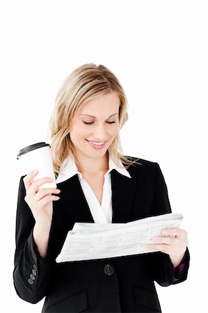simsearch:400-05242665,k - Beautiful businesswoman holding a cup of coffee reading a newspaper against a white background Foto de stock - Super Valor sin royalties y Suscripción, Código: 400-04212323