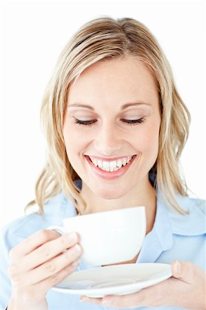 simsearch:400-04188263,k - Glowing businesswoman holding a cup of coffee against a white background Foto de stock - Super Valor sin royalties y Suscripción, Código: 400-04212349