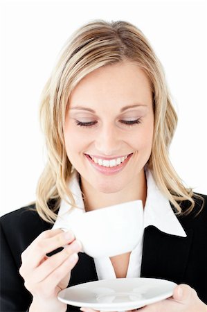 simsearch:400-04188263,k - Charming businesswoman holding a cup of coffee against a white background Foto de stock - Super Valor sin royalties y Suscripción, Código: 400-04212341