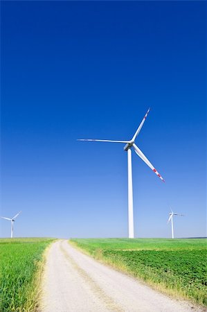 simsearch:400-04983141,k - three wind turbines and empty country road Stock Photo - Budget Royalty-Free & Subscription, Code: 400-04212431
