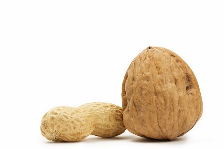 peanut object - peanut and a walnut on white background Photographie de stock - Aubaine LD & Abonnement, Code: 400-04212778