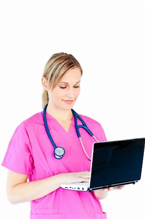 doctor business computer - Charming female doctor holding a laptop against a white background Stock Photo - Budget Royalty-Free & Subscription, Code: 400-04212856