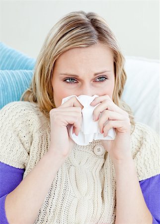 simsearch:400-04212905,k - sick woman using a tissue sitting on a sofa at home Stock Photo - Budget Royalty-Free & Subscription, Code: 400-04212905
