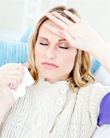 simsearch:400-04212905,k - Diseased woman with headache lying on the sofa in the living-room at home Stock Photo - Budget Royalty-Free & Subscription, Code: 400-04212909