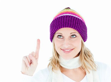 simsearch:400-06132090,k - cheerful woman with a cap showing the top against a white background Photographie de stock - Aubaine LD & Abonnement, Code: 400-04212900