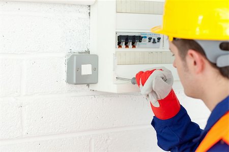 Mature electrician repairing a power plan at work Photographie de stock - Aubaine LD & Abonnement, Code: 400-04212920