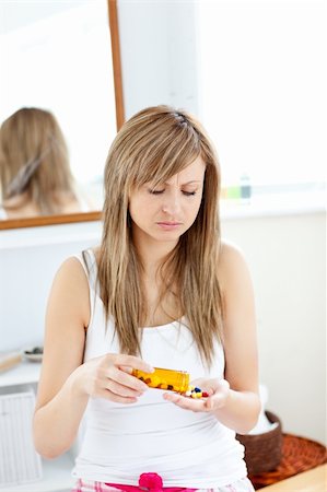 simsearch:400-05892402,k - Diseased woman taking pills in her bathroom at home Stock Photo - Budget Royalty-Free & Subscription, Code: 400-04213013