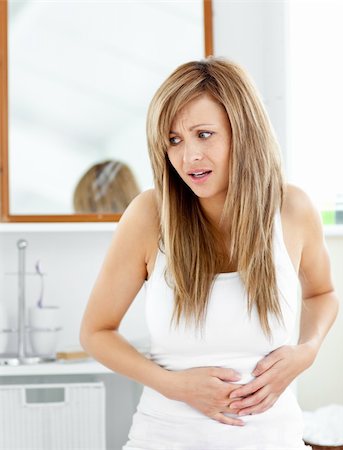 Attractve woman having a stomachache in the bathroom at home Stock Photo - Budget Royalty-Free & Subscription, Code: 400-04213052