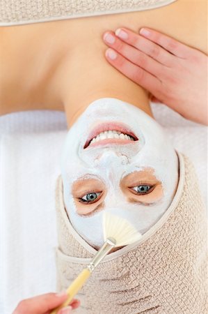 simsearch:400-04127590,k - Glowing young woman receiving white cream on her face in a spa center Stock Photo - Budget Royalty-Free & Subscription, Code: 400-04213072