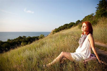 Girl at hill in sunrise. Stockbilder - Microstock & Abonnement, Bildnummer: 400-04213208