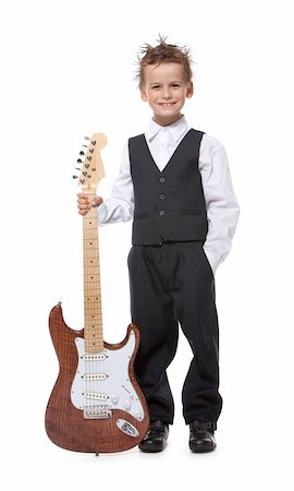 electric bass white background - Boy holding a guitar isolated on a white background Stock Photo - Budget Royalty-Free & Subscription, Code: 400-04213209