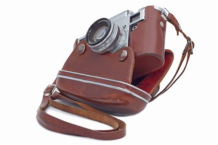 Old camera in cover isolated on white. Stockbilder - Microstock & Abonnement, Bildnummer: 400-04213267