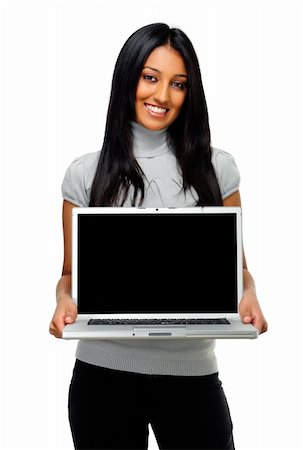 Adorable Indian girl holds laptop with blank screen Foto de stock - Super Valor sin royalties y Suscripción, Código: 400-04213374