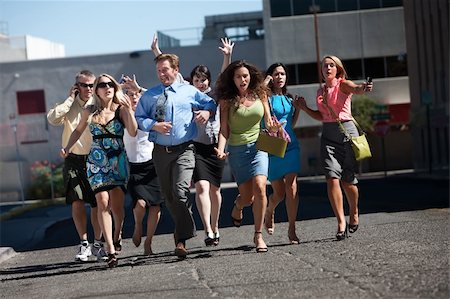 running in heels - Group of hard working business men and women run down city street. Stock Photo - Budget Royalty-Free & Subscription, Code: 400-04213543