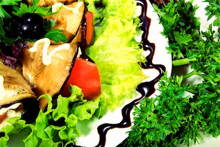 Appetizer made of rolled egg-plants served with salad Stockbilder - Microstock & Abonnement, Bildnummer: 400-04224111