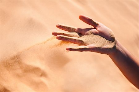 Sand is falling from girl's arm Stock Photo - Budget Royalty-Free & Subscription, Code: 400-04224411