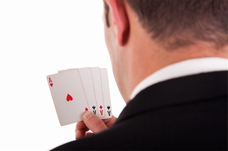 detail of the shore of a man with four cards with four aces in hand, isolated on white background, studio shot Stock Photo - Budget Royalty-Free & Subscription, Code: 400-04224590