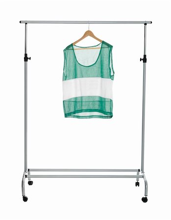 dresses closet - Green sport shirt on a Clothes Rack isolated Photographie de stock - Aubaine LD & Abonnement, Code: 400-04225215