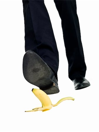 shoes in danger - Banana peel slip isolated on white background Stock Photo - Budget Royalty-Free & Subscription, Code: 400-04225221