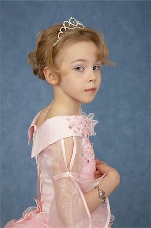 simsearch:400-04735006,k - Little girl in fashionable dress on a blue background Stock Photo - Budget Royalty-Free & Subscription, Code: 400-04225369