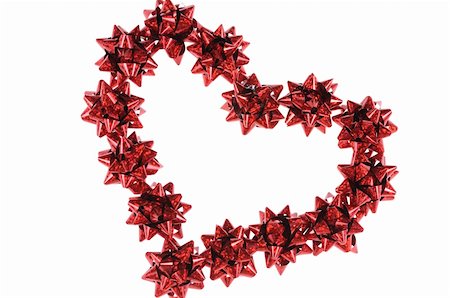 simsearch:400-03986920,k - Heart from red bows isolated on white background Stock Photo - Budget Royalty-Free & Subscription, Code: 400-04225836