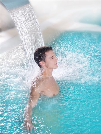 spa hydrotherapy man waterfall jet turquoise swimming pool water Stock Photo - Budget Royalty-Free & Subscription, Code: 400-04225918