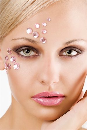 simsearch:400-05314365,k - beauty close up portrait of a pretty young woman with pink crystal stones as make on face Foto de stock - Royalty-Free Super Valor e Assinatura, Número: 400-04225971