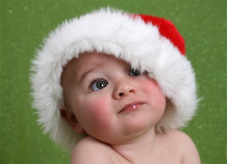 simsearch:400-05727835,k - Dreamy Christmas image of a baby looking into the distance Fotografie stock - Microstock e Abbonamento, Codice: 400-04226756