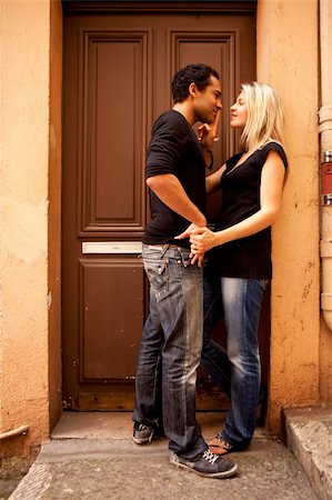 simsearch:400-04549295,k - An attractive couple flirting in an outdoor European setting Foto de stock - Royalty-Free Super Valor e Assinatura, Número: 400-04227009