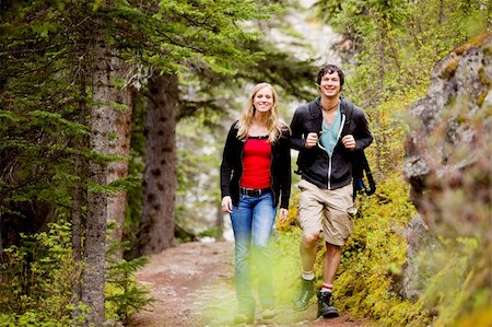 A happy man and woman hiking on a camping trip Stock Photo - Budget Royalty-Free & Subscription, Code: 400-04227064