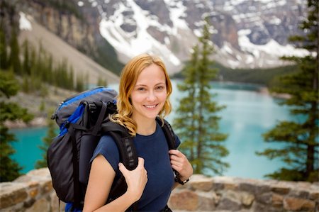 A portrait of a young happy woman infront of a beautiful mountain landscape Stock Photo - Budget Royalty-Free & Subscription, Code: 400-04227071