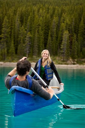 A happy couple canoeing on a glacial lake Stock Photo - Budget Royalty-Free & Subscription, Code: 400-04227083