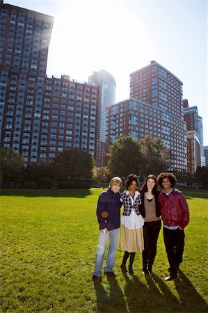 A group of young adults in an urban setting - taken into the sun with slight solar flare Stock Photo - Budget Royalty-Free & Subscription, Code: 400-04227982