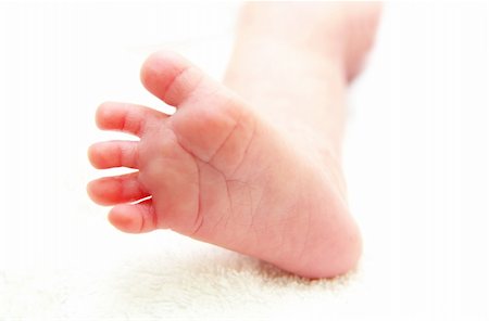 simsearch:400-04235194,k - little foot of newborn baby on white Stock Photo - Budget Royalty-Free & Subscription, Code: 400-04229127