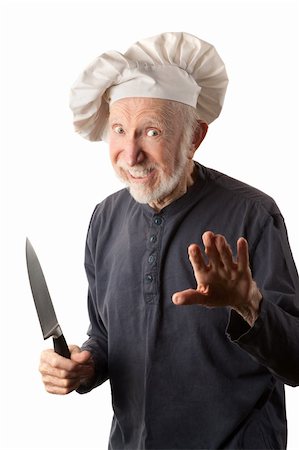 dangerous kitchen - Funny senior chef with big white hat and knife Stock Photo - Budget Royalty-Free & Subscription, Code: 400-04229286