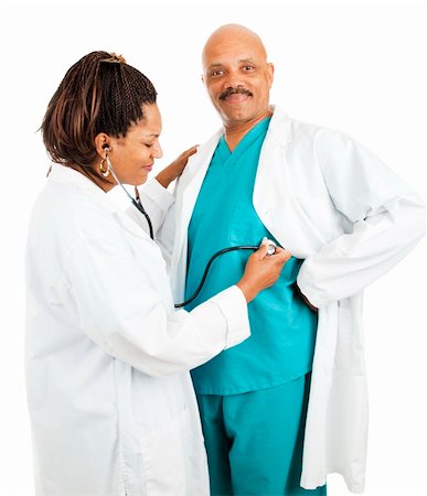 Cute african-american doctors.  She's pretending to give him a checkup.  Isolated on white. Stock Photo - Budget Royalty-Free & Subscription, Code: 400-04229383