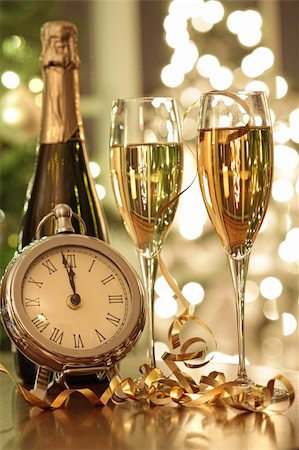 Champagne glasses ready to bring in the New Year Stock Photo - Budget Royalty-Free & Subscription, Code: 400-04229528